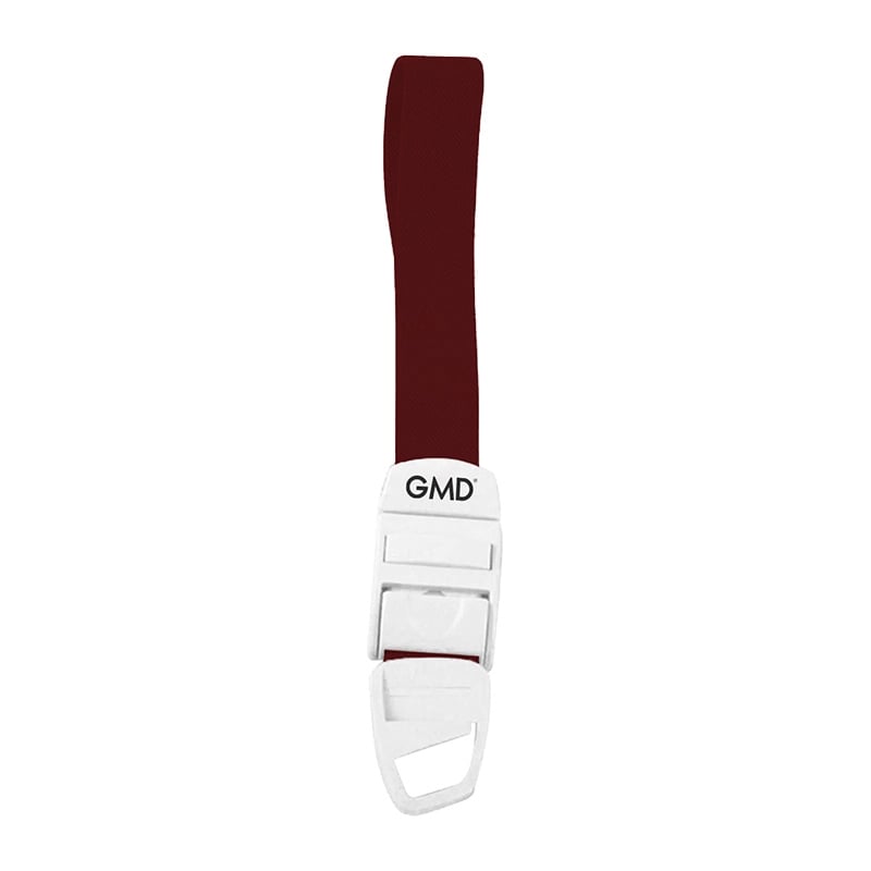 Torniquete GMD Color Vino, fabricado en material elástico tipo látex y poliéster; cuenta con un sistema de broche de seguridad y liberación rápida de color blanco, elaborado en material plástico.. Haga clic para ampliar la imagen