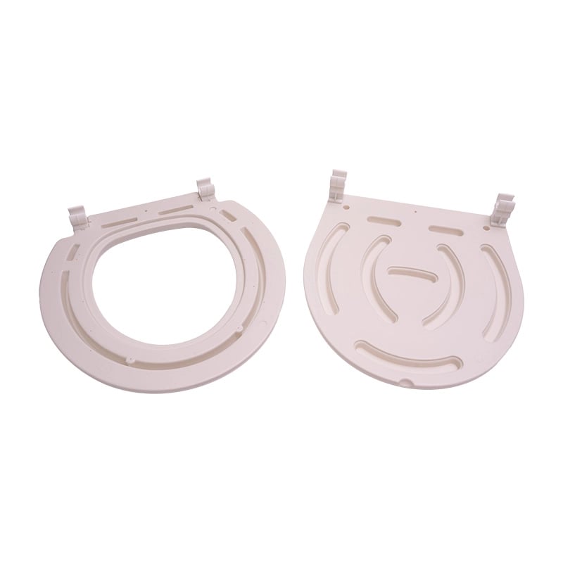 Aro y tapa para cómodo sanitario, vista posterior, de forma ovalada y color blanco. Ambos cuentan con sistema de unión en la parte superior y relieves alrededor. El aro con abertura central.. Haga clic para ampliar la imagen