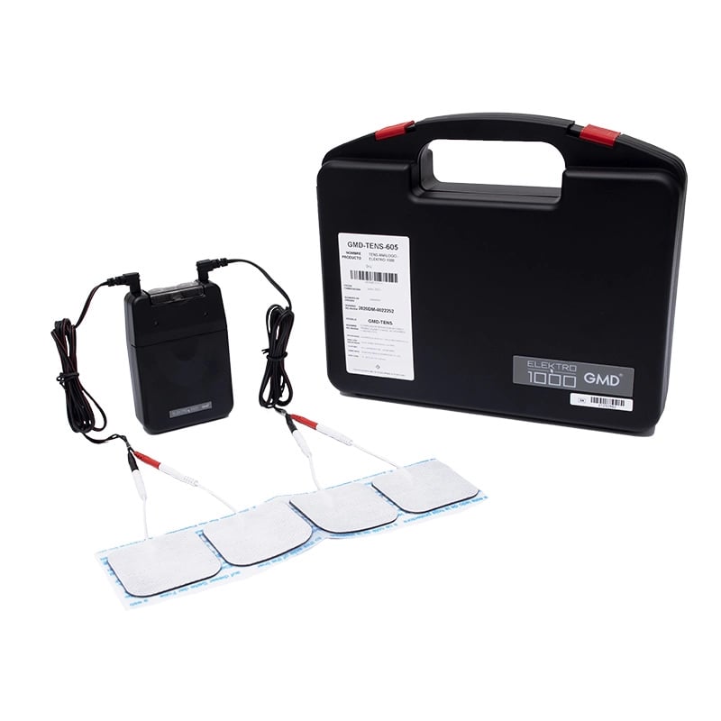 Tens análogo - elektro 1000, kit con dispositivo de color negro, cables conductores conectados a ambos puertos, con extremos en colores negro y rojo, unidos a cuatro electrodos adhesivos de forma rectangular, de color blanco en la parte superior y negro e. Haga clic para ampliar la imagen