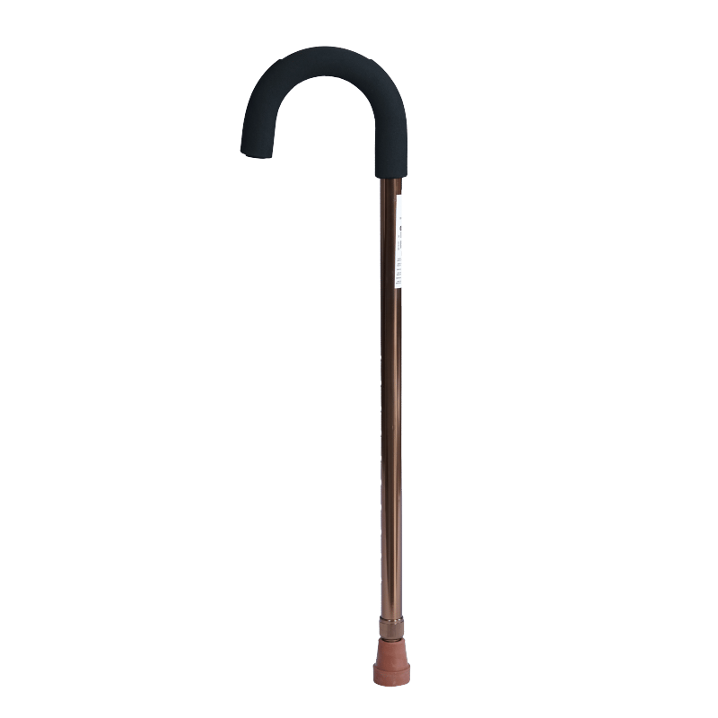Baston tipo paraguas, estructura metálica color bronce. En el extremo superior con empuñadura negra, debajo etiqueta blanca con información impresa en negro. En la parte central mecanismo ajustable de altura con orificios y en la base goma antideslizante 