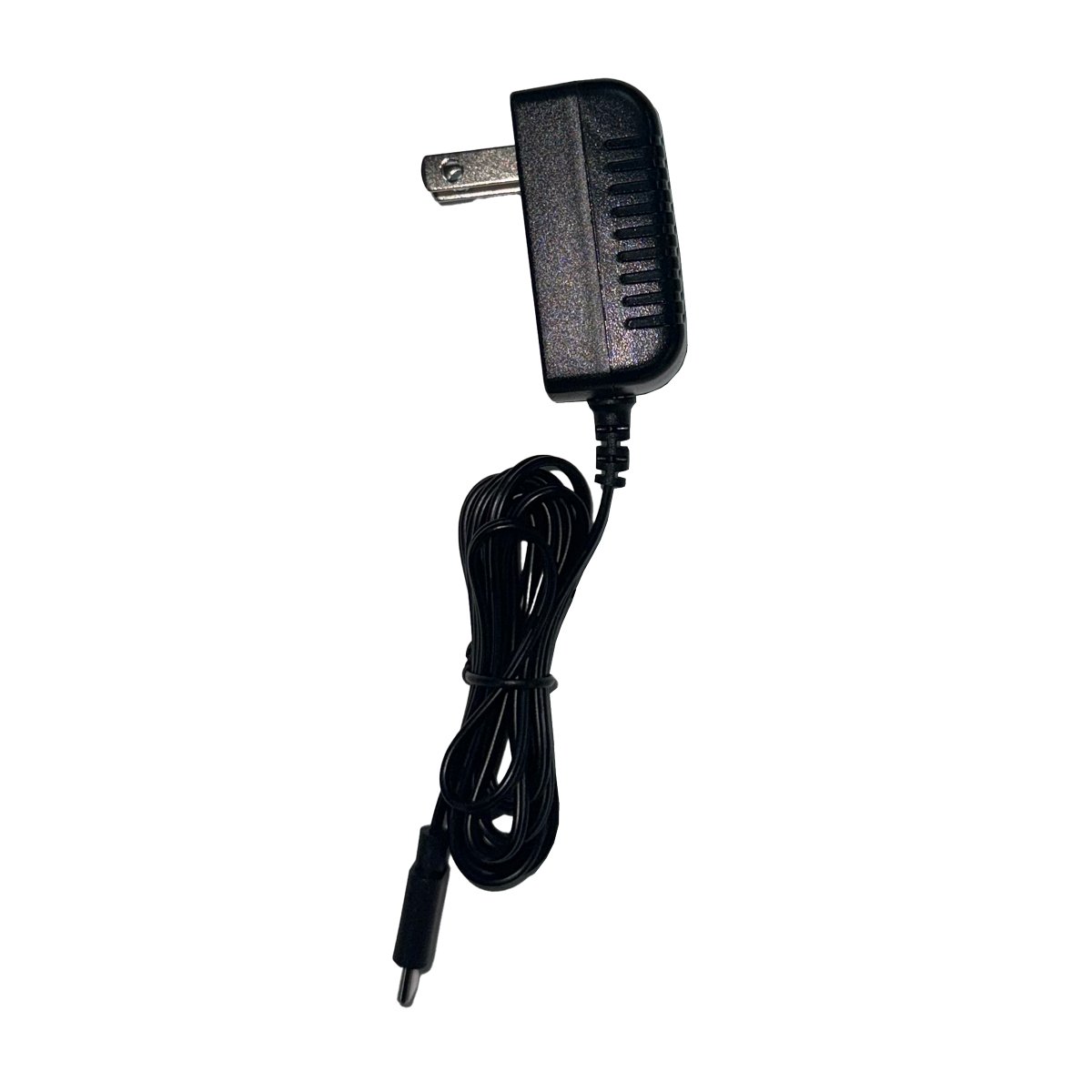 Adaptador A/C Para Monitor de Presión Arterial LATIDOS, color negro, con cuerpo rectangular y bordes redondeados. En el extremo lateral líneas en relieve y, en la parte posterior, dos conectores plateados para conexión al tomacorriente. En la parte inferi. Haga clic para ampliar la imagen