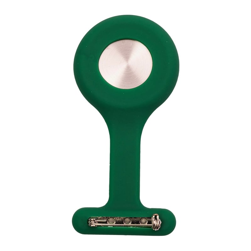 Reloj gmd color verde oscuro, con carcasa de silicona en forma de “T”. En la parte superior presenta una tapa metálica circular de color plateado y en la parte inferior un broche para sujetarlo.. Haga clic para ampliar la imagen