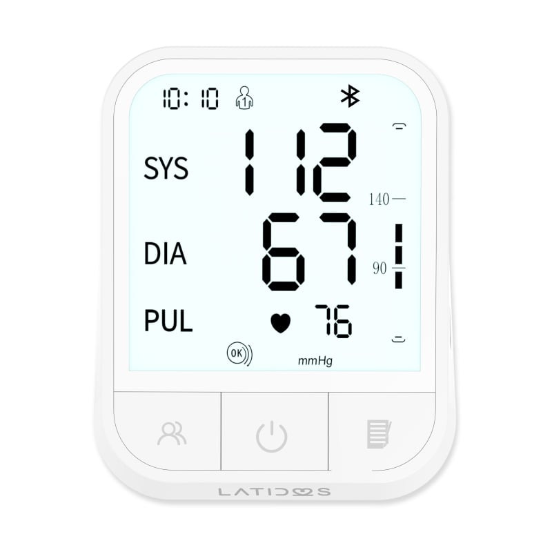 Tensiómetro Latidos con Bluetooth, vista frontal, de color blanco, con botones ubicados en la parte inferior. Presenta pantalla con fondo verde agua y dígitos en color negro.. Haga clic para ampliar la imagen