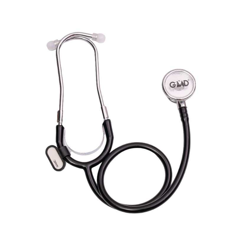 Fonendoscopio OIS 100S, tubo auricular metálico plateado en forma de Y con olivas blancas en los extremos. Sobre el tubo una pieza metálica que sujeta un reborde en forma de U de color blanco, la manguera negra enrollada en la parte inferior, en el lado i. Haga clic para ampliar la imagen